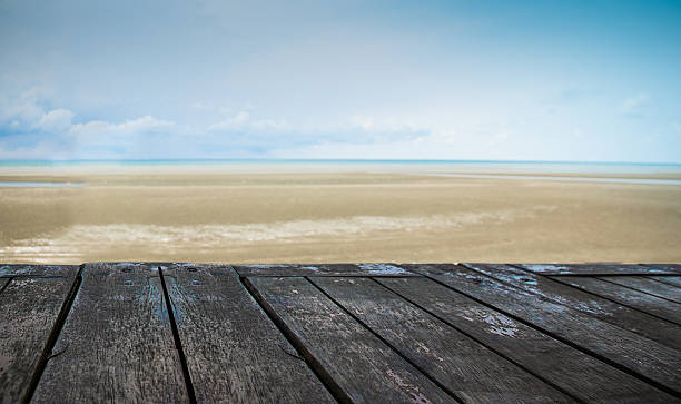 istock Old wood in front the beach 514692823