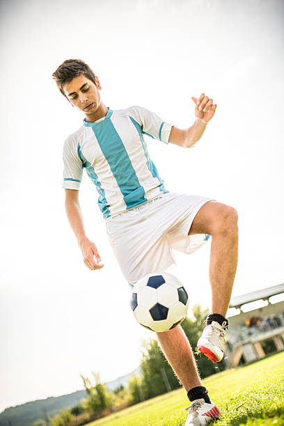 istock Soccer player playing with soccer ball 514714284