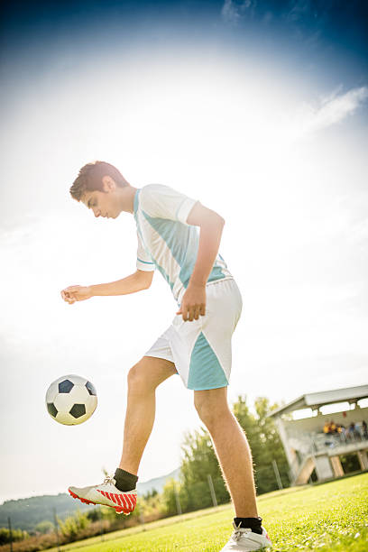 istock Soccer player playing with soccer ball 514714402