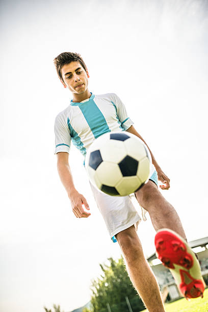 istock Soccer player playing with soccer ball 514714526