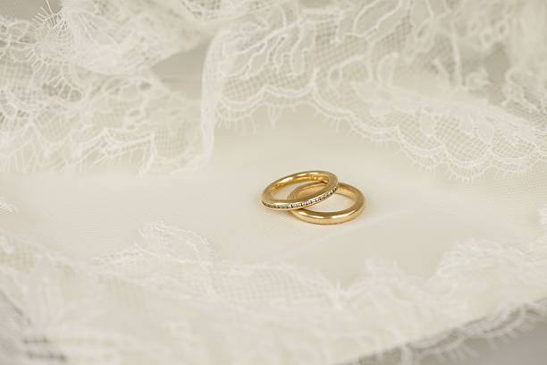 istock Golden wedding rings with embroidered lace 514715068