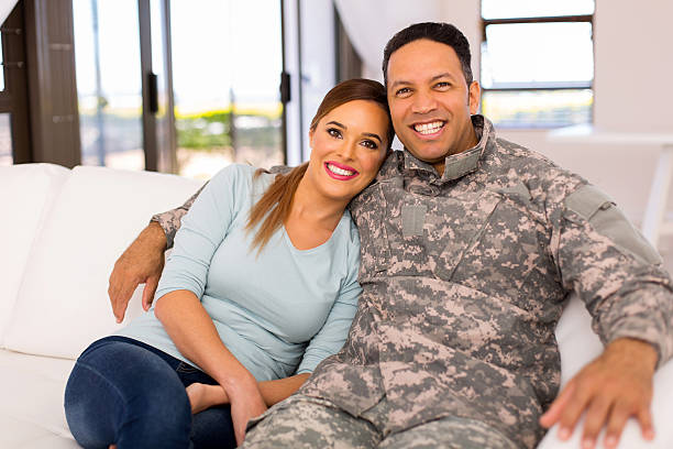 istock military couple relaxing on the couch 514716484