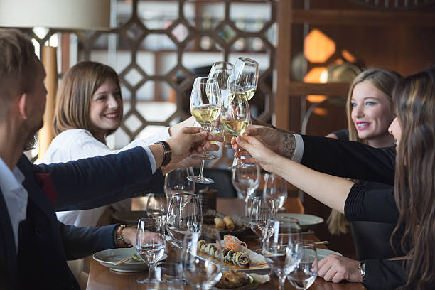 istock Friends toasting with wine in restaurant 514717552