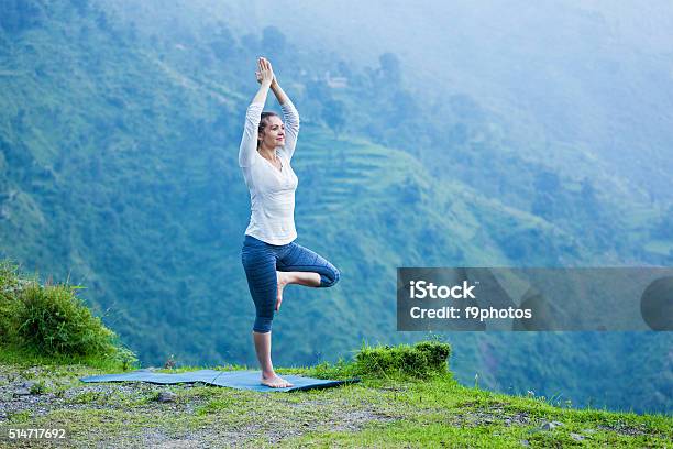 Woman In Yoga Asana Vrikshasana Tree Pose Outdoors Stock Photo - Download Image Now - Active Lifestyle, Activity, Adult