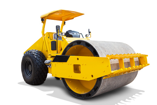 Image of a modern road roller with yellow color, isolated on white background