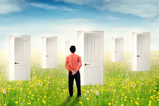 istock Man looking at the chance doors on meadow 514719066