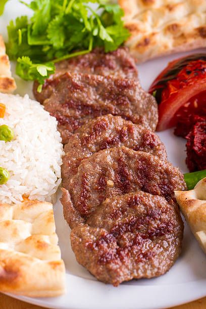 Delicious Turkish Traditional Kebab Kofte with pilaf (meatballs) stock photo