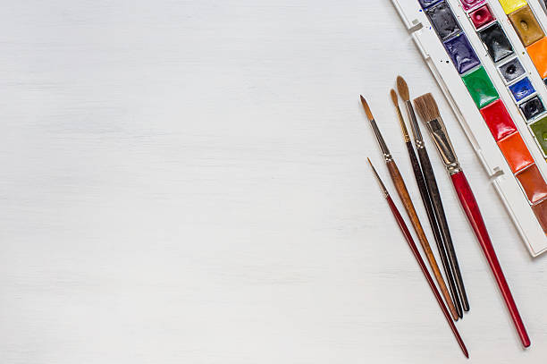 istock Different watercolor paintbrushes with colors 514722566