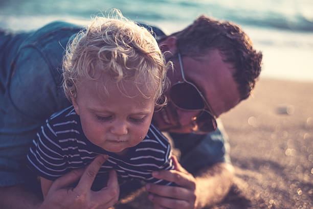istock Father and son on the beach 514722674