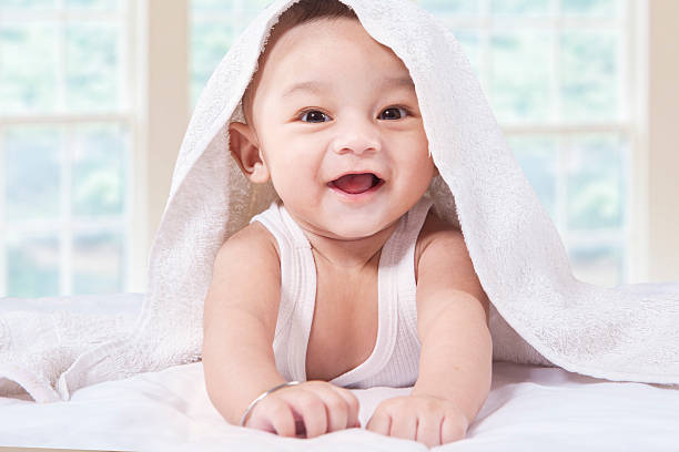 istock Adorable child with a towel on bed 514722764