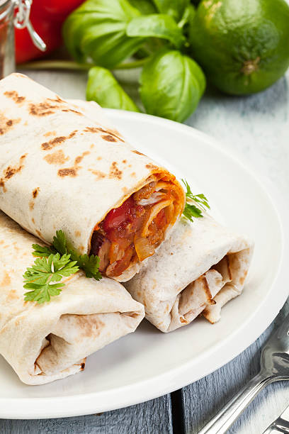 istock Mexican burritos on a plate 514723172