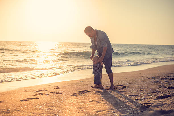 istock Father and son on the beach 514723460