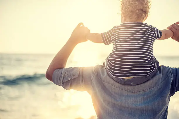 Photo of Father and son on the beach