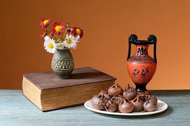 istock Fresh medlar on a plate and books on the table 514723764