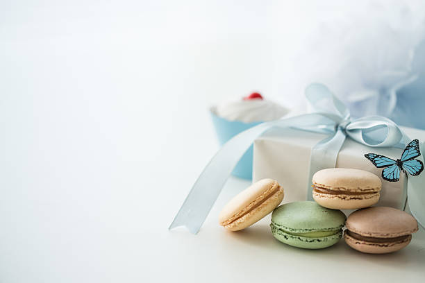 Sweet party table with macaroons and gift