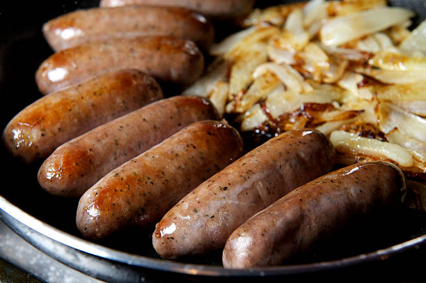 istock Sausage & onion frying 514724314