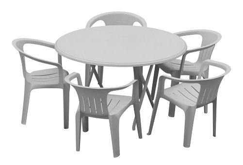 Plastic table and chairs isolated on white. Clipping path included.