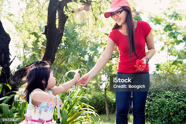 Fillipino Mother And Daughter Play In A Park Stock Photo - Download Image Now - Family, 18-23 Months, Asia