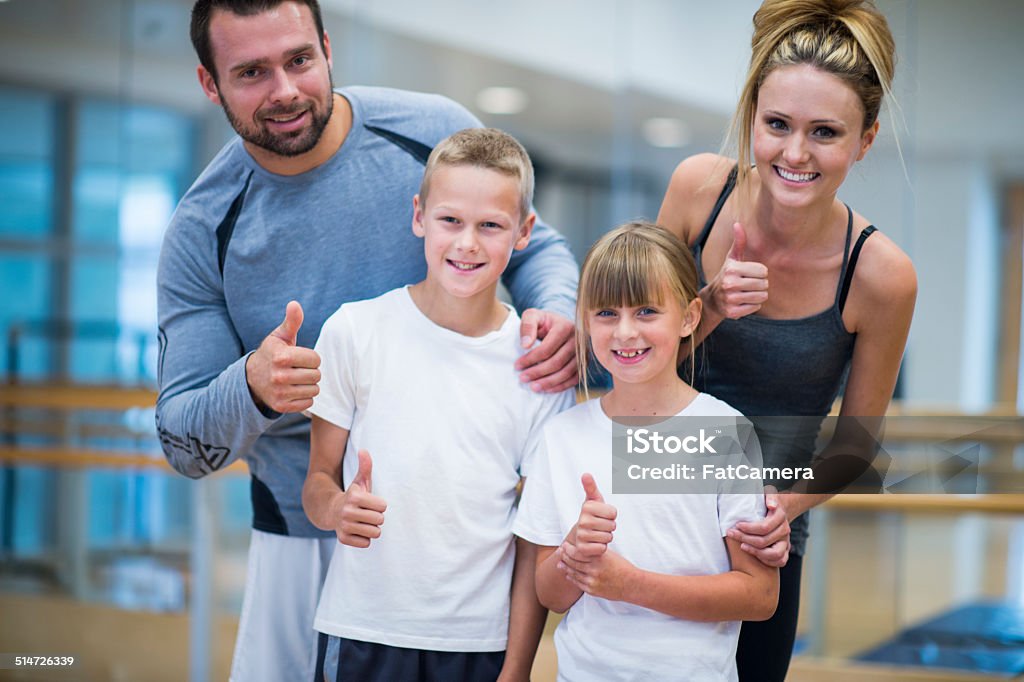 Family fitness Family doing exercise at the gym Family Stock Photo