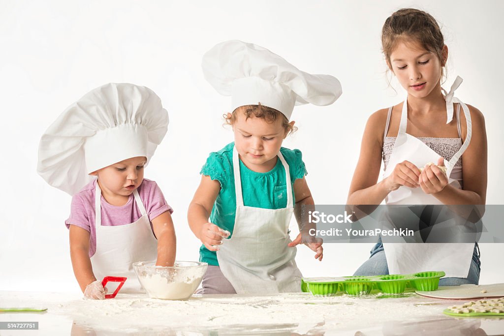 Kids fun - cooks paty Children play in the cooks Chef Stock Photo