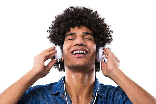 istock Man with afro enjoying music 514729858