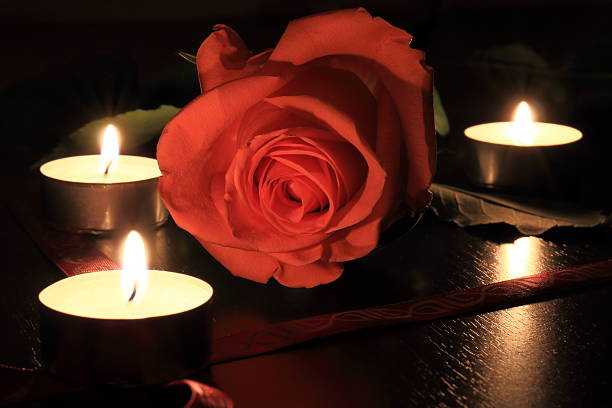 istock Macro of pinc rose with candles 514730694
