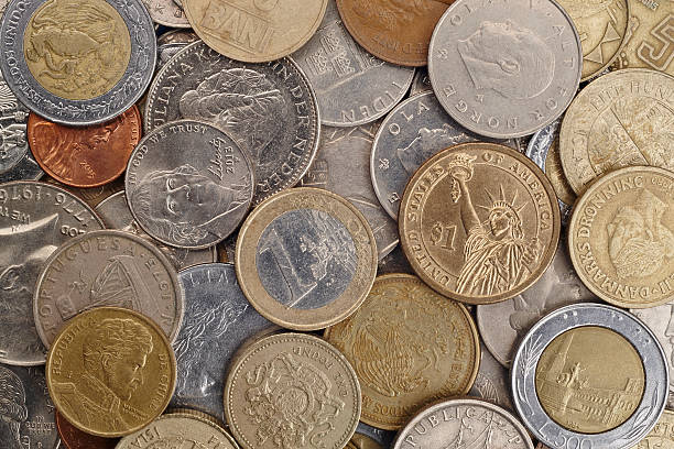 istock Different kinds on coins over a white background. Macro detail 514730818