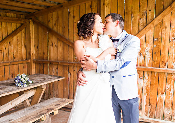 istock wedding pair hugging and kissing 514730954