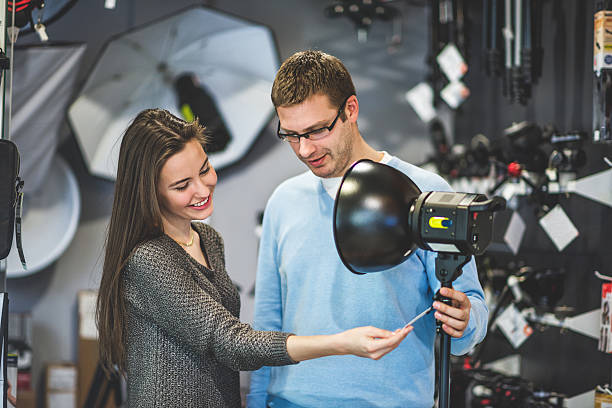 istock Young woman buying lighting equipment 514731436