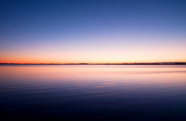 istock First light of day creates dramatic colors in  Ocean mirror 514732784