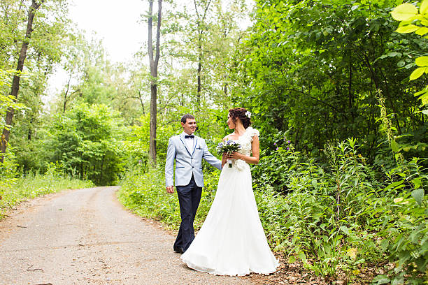 istock Bride and groom at wedding Day walking Outdoors on spring 514733176