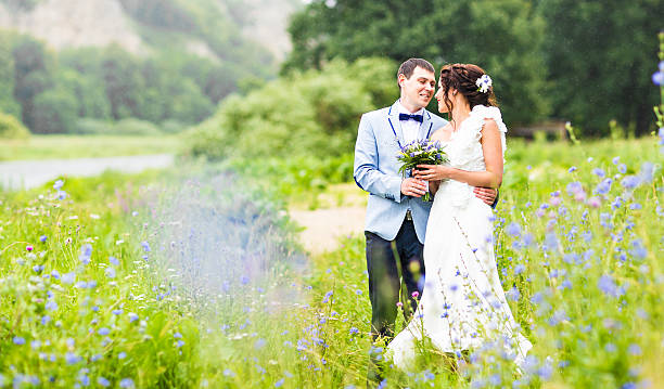 istock wedding pair hugging and kissing 514734054