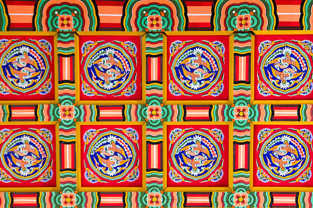 Colorful wall art in Babylon, Iraq displays painted animals on blue bricks, highlighting ancient cultural heritage and artistry.