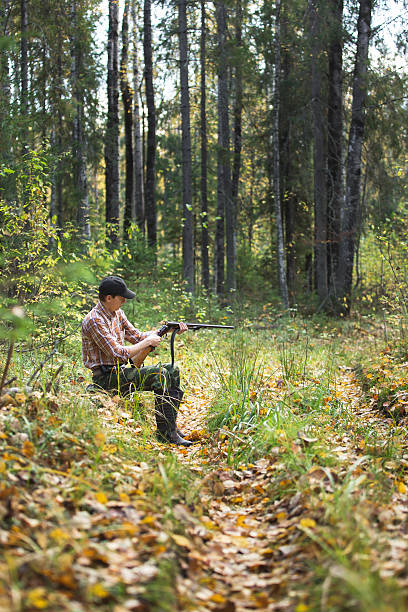 istock Male hunter in the woods 514739612