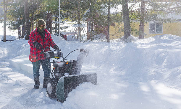 istock Canadian Man operates snow thrower on winter day in Canada. 514740202