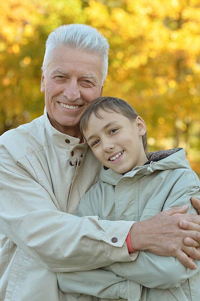 istock Grandfather and grandson in park 514742106