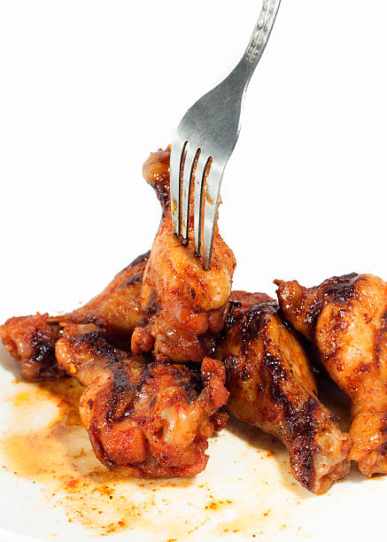 istock Grilled chicken wings isolated on white background 514755911