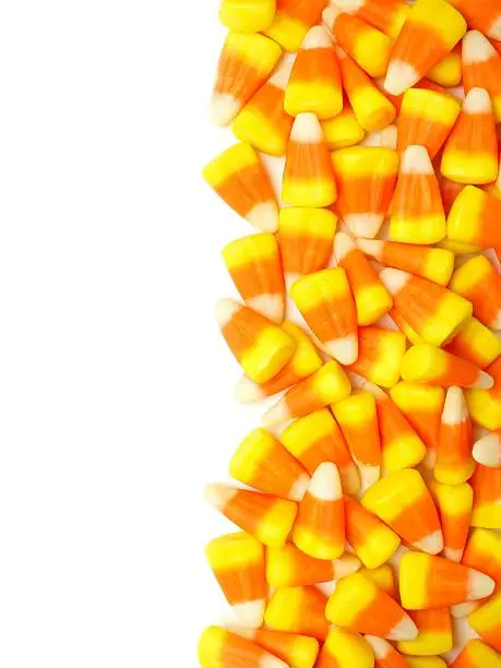 Halloween candy corn vertical border over white