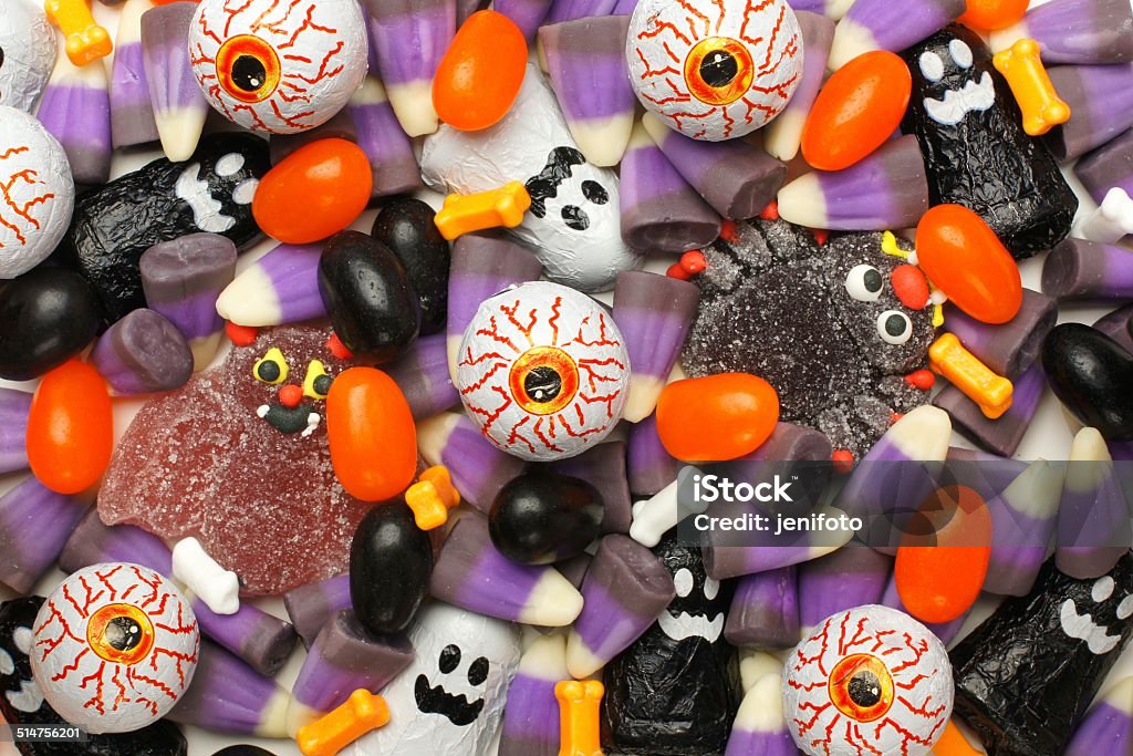 Halloween candy background Halloween background of mixed candies, dark color theme Candy Stock Photo