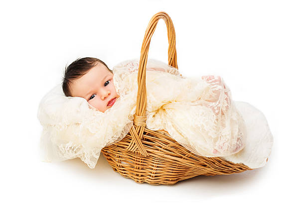 istock Newborn baby smiling in a wicker basket 514756713