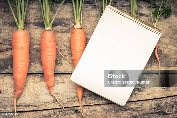Menu Background Recipe Book With Fresh Carrots On Wooden Table Stock Photo - Download Image Now