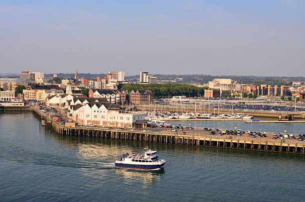Southampton Eastern Docks A ferry leaves the Southamptom eastern docks along Quay street with the town quay marina and skyline in the background as seen from the River Test on a hazy afternoon marina photos stock pictures, royalty-free photos & images