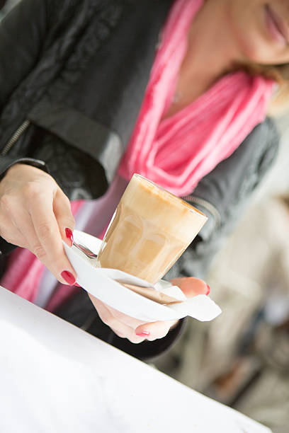 istock Woman holding cappuccino 514757629