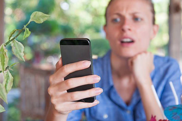 istock Woman holding smart phone 514757793