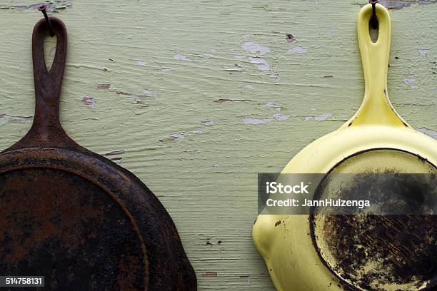 Two Vintage Frying Pans Hanging Against Old Wood Stock Photo - Download Image Now - Frying Pan, Rusty, American Culture