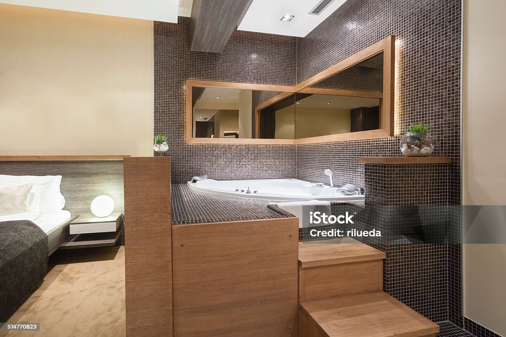 Modern open hot tub in bedroom Accessibility Stock Photo