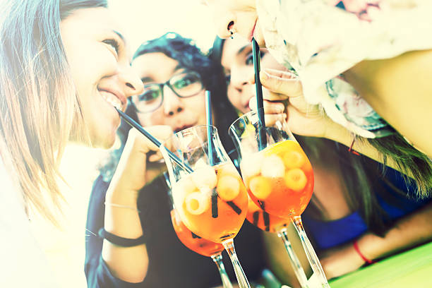 Young woman drinking a cocktail