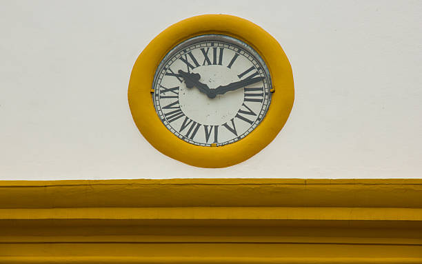 istock Old Roman Clock in a Church Wall 514771193