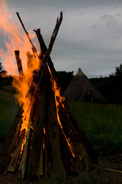 istock Bonfire with a roundhouse in the background.. 514771570