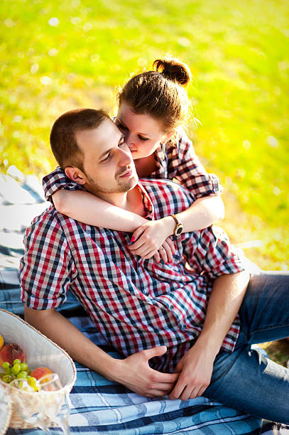istock happy young couple enjoying picnic. Toned image 514772697